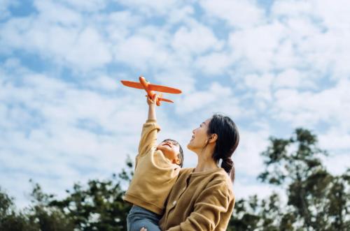 mother and child playing outside 